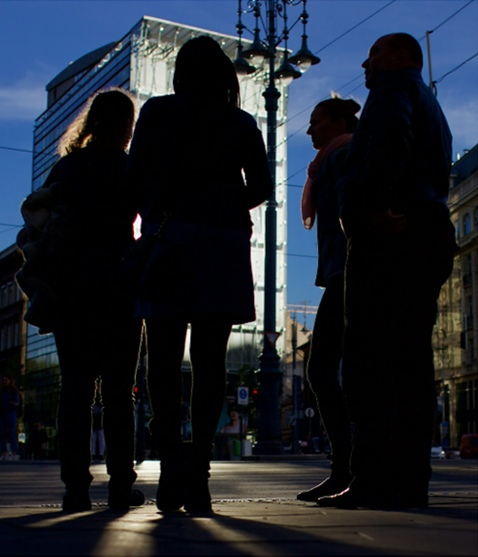 smiling man beside writing person